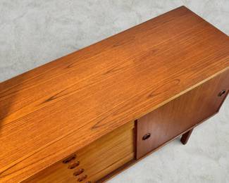 ALTERNATE VIEW: Teak Sideboard (Condition: bottom drawer needs adjustment to close completely. There is a vertical hairline separation on the right side of the sliding panel). Measurements: 32"H x 47 1/2"L x 18 1/2"D. AVAILABLE FOR: $800