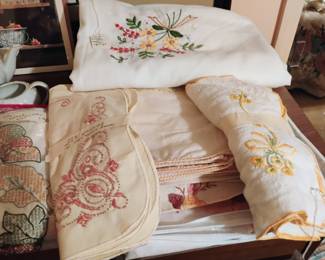 Lots of needle point and embroidery pieces. Some Runners with matching placemats and tablecloths and napkins 