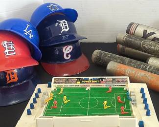 Vintage Baseball Helmets, Bats, And Football Game