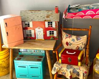 dollhouse with furniture, tea set table, child size stove and refrigerator, rocking chair and doll suitcase