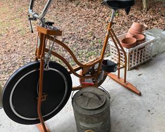 vintage exercise bike and gas can
