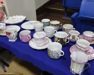 Porcelain mustache and shaving cups.