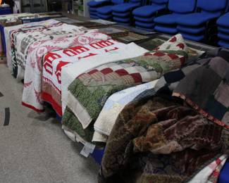 Several handmade quilts and crazy quilts.