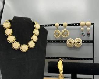 White And Gold Earrings With A Matching Bracelet And Necklace