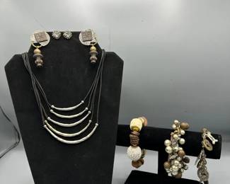 Three Bracelets With Earrings And A Neck Necklace To Match
