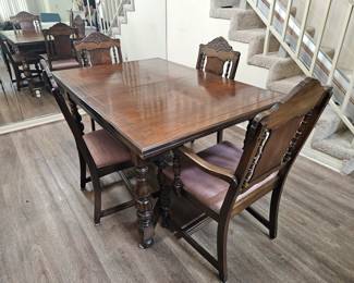 Circa 1920-30 Jacobean dining set with 6 chairs, leaf and table cover.