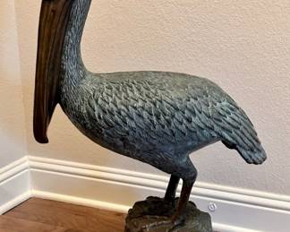 Bronze Pelican Statue Standing on Pier Pole