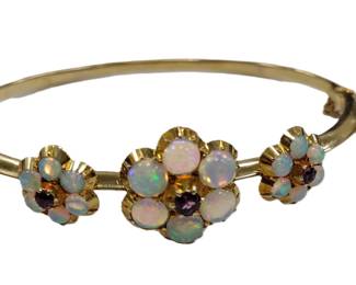 UNMARKED 14K HOLLOW GOLD BANGLE SET WITH WHAT APPEAR TO BE SYNTHETIC OPALS