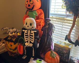Halloween decor including ghosts, skeletons, pumpkins, and more