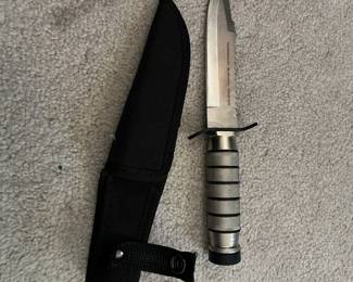 Survivor HK-695 fixed-blade survival knife with a sheath