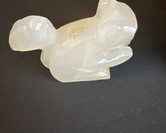hand-carved figurine of a rabbit in a white translucent stone