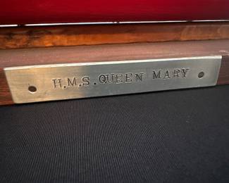 collectible model of an early 20th-century four-funnel ocean liner (H.M.S. Queen Mary)