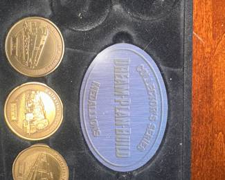 set of collectible medallions in a display case