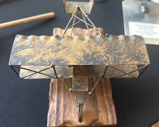 vintage metal sculpture of a bi-plane