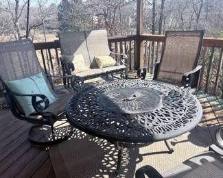 cast metal patio table with chairs
