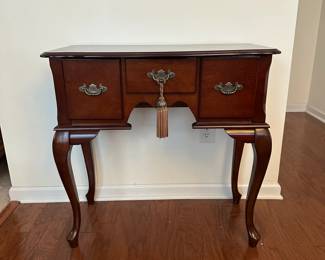 H42 - $50. Small Entry Table. (Has water damage on the top right from a plant - easy to cover with a runner!) Measures 31.5" x 16" deep x 31" tall. All 3 drawers slide. Very sturdy. 