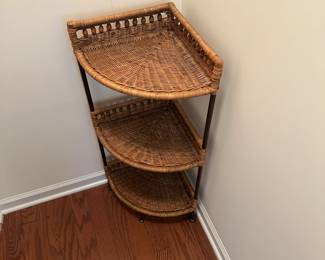 H80 - $30. Corner Wicker Shelf. Measures 13" out from each corner x 36" tall. 