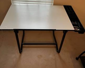 H64 - $40. Adjustable Desk used for painting & crafts. Measures 42" x 31" x 31" tall. 