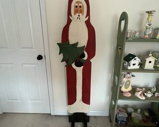 H91 - $35. Folk Art Santa. Measures 16" x 10" x 64" tall. 