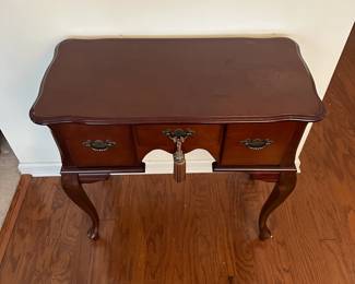 H42 - $50. Small Entry Table. (Has water damage on the top right from a plant - easy to cover with a runner!) Measures 31.5" x 16" deep x 31" tall. All 3 drawers slide. Very sturdy. 