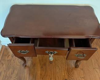 H42 - $50. Small Entry Table. (Has water damage on the top right from a plant - easy to cover with a runner!) Measures 31.5" x 16" deep x 31" tall. All 3 drawers slide. Very sturdy. 