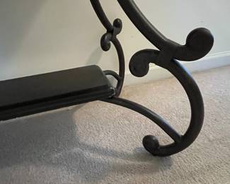 H75 - $60. Sofa Table. Wooden top with metal base. Measures 48" x 20" x 28.75" tall. 