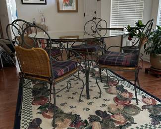 H3 - $175. Glass Top Table is 4' across x 30" tall. Includes 4 Iron framed chairs with cushioned seats. Glass has some minor scratches from use but nothing sharp and no big chips. 