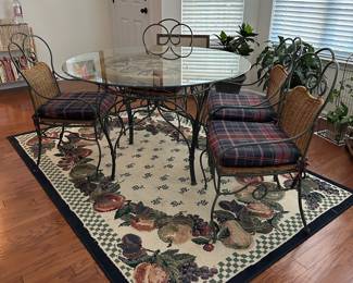 H3 - $175. Glass Top Table is 4' across x 30" tall. Includes 4 Iron framed chairs with cushioned seats. Glass has some minor scratches from use but nothing sharp and no big chips. 