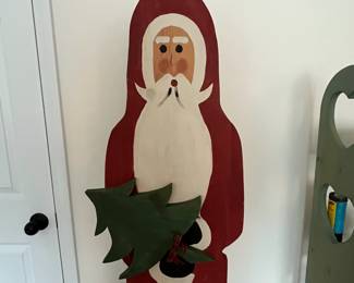 H91 - $35. Folk Art Santa. Measures 16" x 10" x 64" tall. 