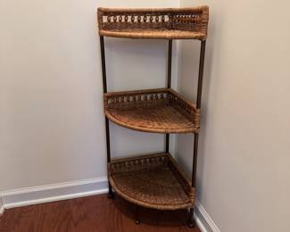 H80 - $30. Corner Wicker Shelf. Measures 13" out from each corner x 36" tall. 