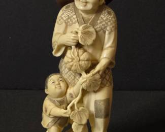 Japanese Ivory Okimono of a Farmer and Child, Signed Gyokuzan