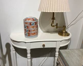 console, brass lamp, asian stacking bowls