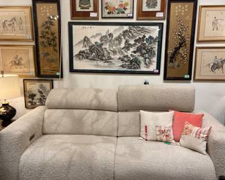 Bernhardt reclining sofa, asian style artwork, glass coffee table