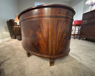 Maitland-Smith Regency Style inlayed Mahogany oval desk with pristine hand tooled leather writing surface.                                                                                                          28" H 63 1/2" W X 26" D          