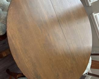 Solid Wood Distressed Pedestal dining table with 6 chairs  31” H x 45” D
27” at tall at apron
Has one leaf to that extend stable to 52" and two armchairs