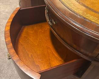 Maitland-Smith Regency Style inlayed Mahogony oval partners desk with hand tooled leather writing surface.                                                                                                          28" H 63 1/2" W X 26" D           empire, neoclassical    