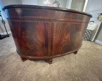 Maitland-Smith Regency Style inlayed Mahogany oval partners desk with pristine hand tooled leather writing surface.                                                                                                          28" H 63 1/2" W X 26" D          