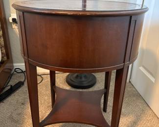 Kunzelmann-Esser Co. Embossed Leather top round drum table with drawers 25" H X 25" D&nbsp;&nbsp;