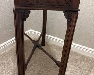 Maitland Smith Chippendale-style mahogany side tea table. Carved fretwork apron and straight legs.   
