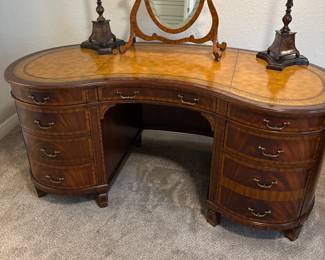 Maitland-Smith Regency Style inlayed Mahogany oval  desk with pristine hand tooled leather writing surface.                                                                                                          28" H 63 1/2" W X 26" D                    empire, neoclassical                                                       