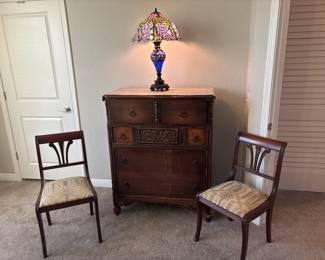 Tiffany style lamp with lighted base                                  Duncan Phyfe inspired-empire style mahogany lyre-back chair with patterned upholstered seat.    Berkey and Kay Style Dresser 38" x 47" x 19"