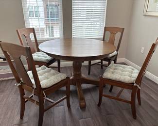 Solid Wood Distressed Pedestal dining table with 6 chairs  31” H x 45” D
27” at tall at apron
Has one leaf to that extend stable to 52" and two armchairs
