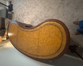 Maitland-Smith Regency Style inlayed Mahogany oval  desk with pristine hand tooled leather writing surface.                                                                                                          28" H 63 1/2" W X 26" D                                                                 