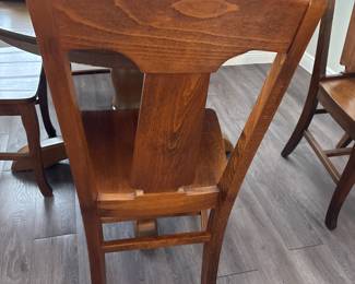 Solid Wood Distressed Pedestal dining table with 6 chairs  31” H x 45” D
27” at tall at apron
Has one leaf to that extend stable to 52" and two armchairs