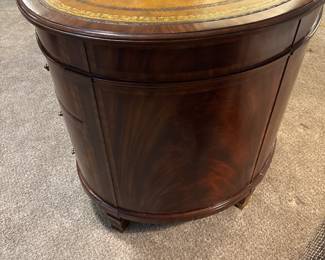 Maitland-Smith Regency Style inlayed Mahogany oval  desk with pristine hand tooled leather writing surface.                                                                                                          28" H 63 1/2" W X 26" D          