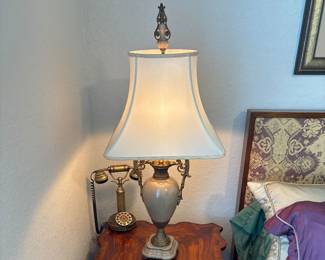 Castilian Urn lamp with shade 40” with finial                                        Maitland Smith End table with drawers and pull outs. 25" H X 24" A 24"                                                                           Sitel Brass Phone                                                                                      