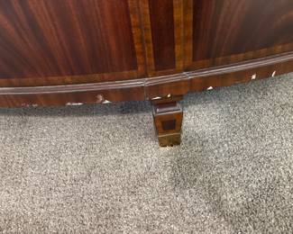 Maitland-Smith Regency Style inlayed Mahogany oval  desk with pristine hand tooled leather writing surface.                                                                                                          28" H 63 1/2" W X 26" D          