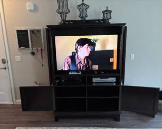 Samsung UN50DU8000FXZA 4K UHD Tizen TV                   inside  Solid maple locking credenza Miller Road By Baker 69” x 50” x 23” with  Maitland-Smith Iron three piece decor