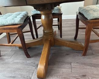 Solid Wood Distressed Pedestal dining table with 6 chairs  31” H x 45” D
27” at tall at apron
Has one leaf to that extend stable to 52" and two armchairs