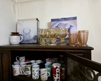 Several coffee cups in all styles and coffee pots, old and new!